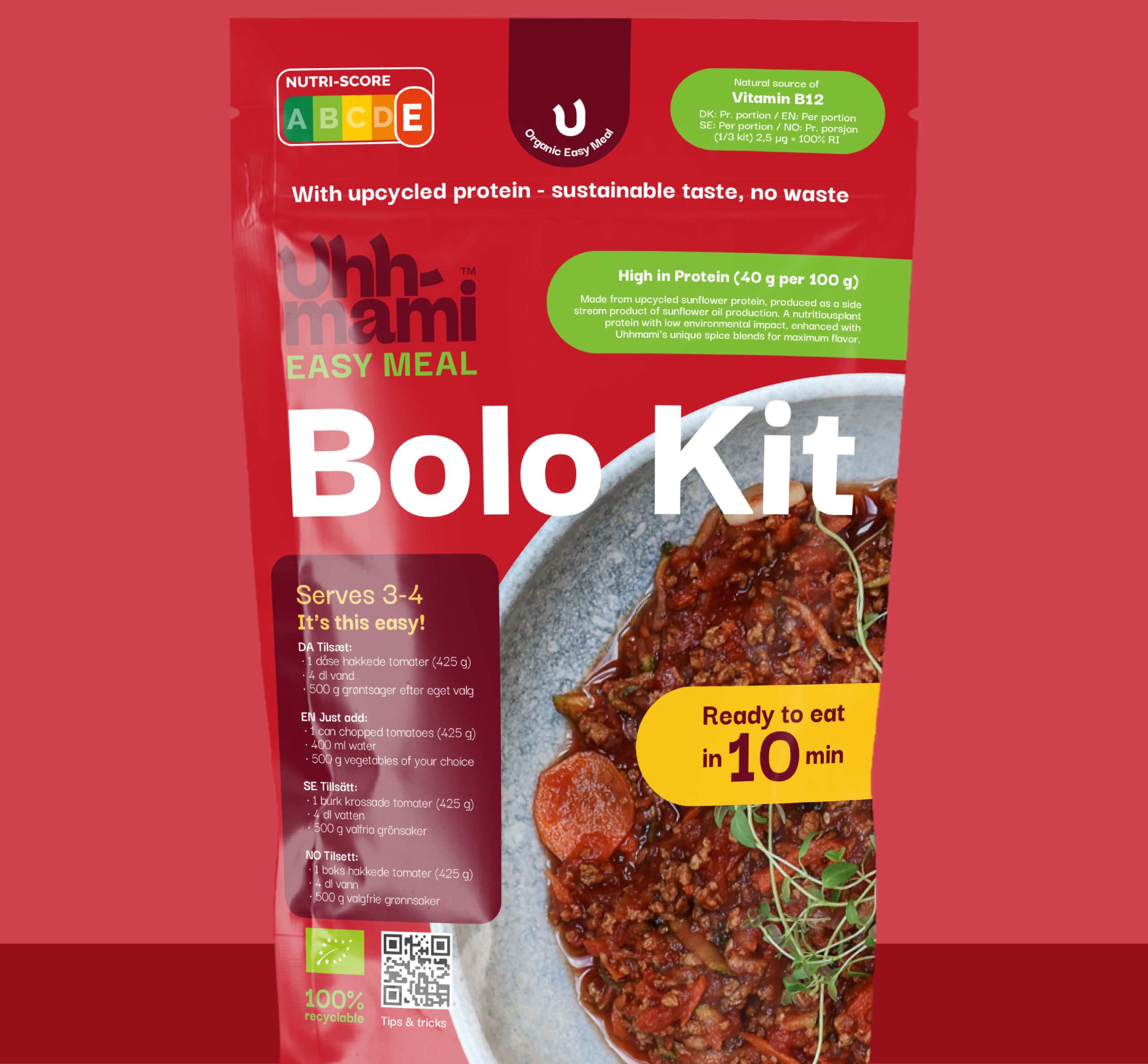 Red packaging of an organic Bolognese kit with a bowl of Bolognese, parsley garnish, and text highlighting protein content and sustainability.
