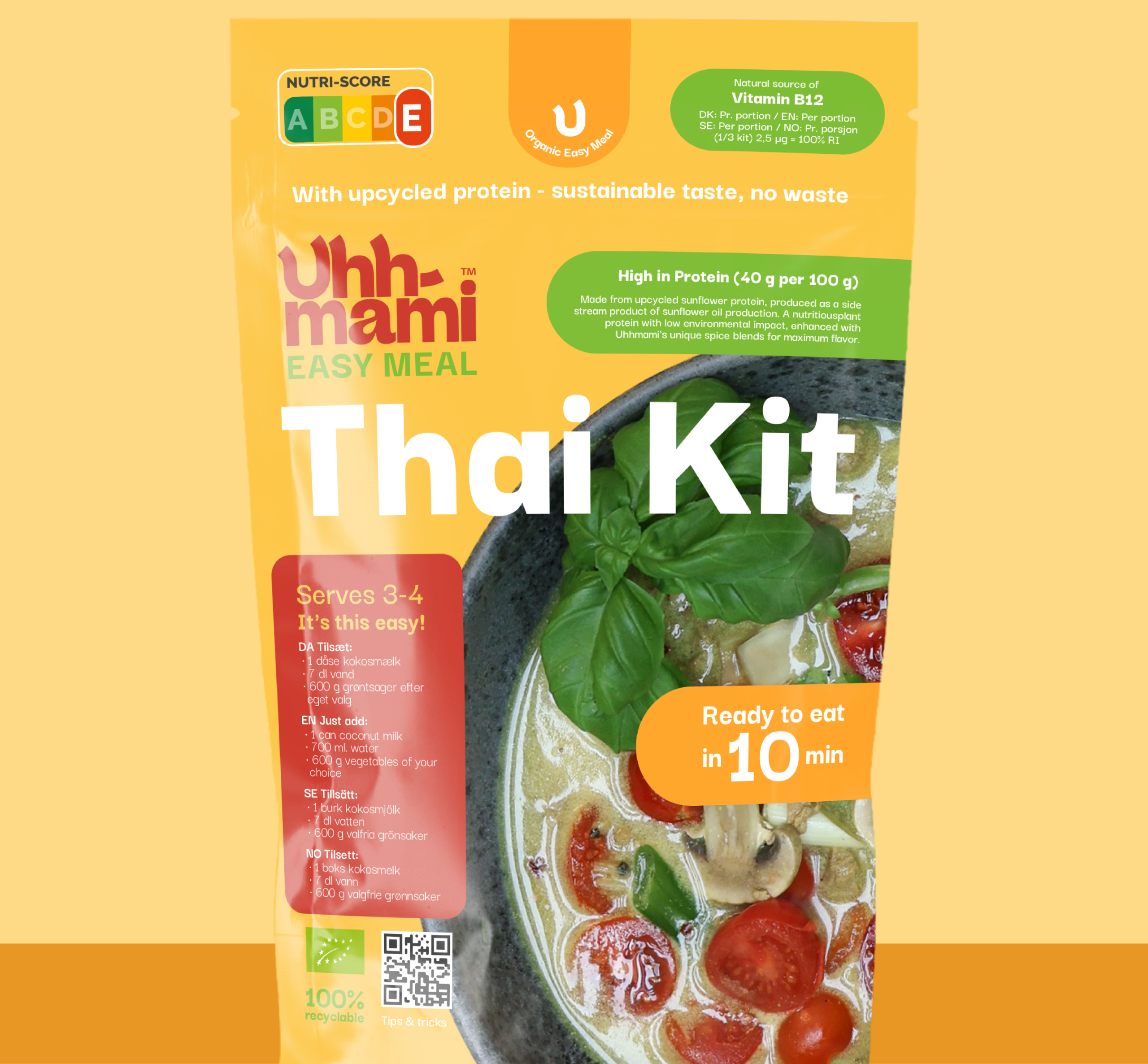A yellow package of Uhhmami organic Thai soup kit with an image of soup and vegetables on the front, text details about protein content, and preparation time.